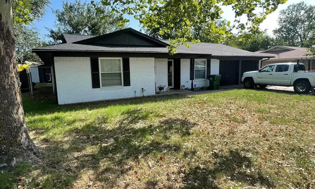Professional roofing crew working on a residential roof in Spring Hill